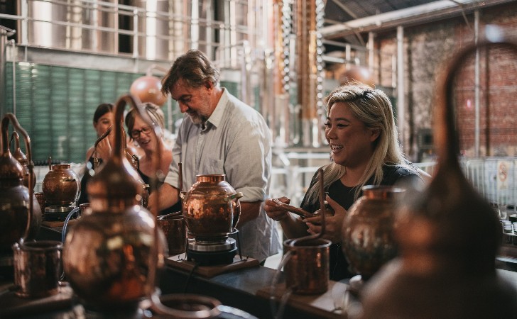 people make gin at boutique distillery