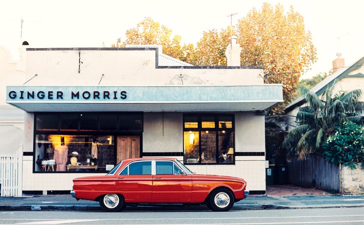 ginger morris shopfront with retro red car out front