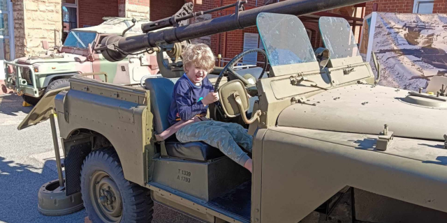 Army Museum of WA - young boy sitting in an old army vehicle 