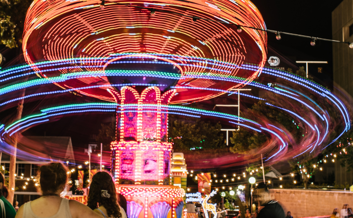 colourful lights as Dream Swinger carnival fairground ride swings out