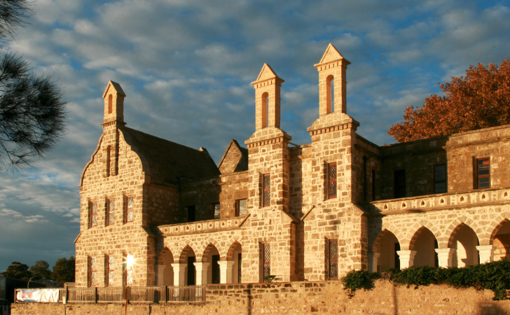 Gothic limestone building is striking against blue sky