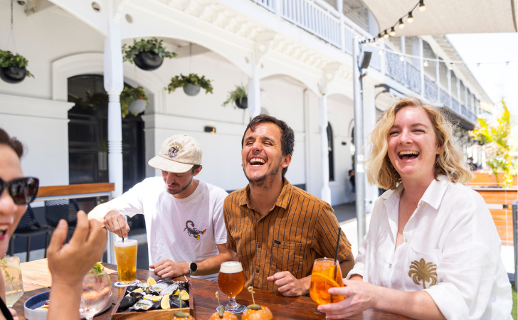 People laughing over casual arvo hangs in Fremantle