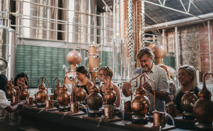 People having a great time distilling their own gin at Republic of Fremantle's Gin School