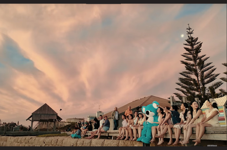 A still from JKT48's music video at Bathers Beach