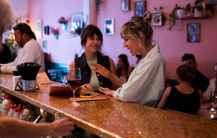 Two patrons enjoying a drink at the bar inside The Flaming Galah.