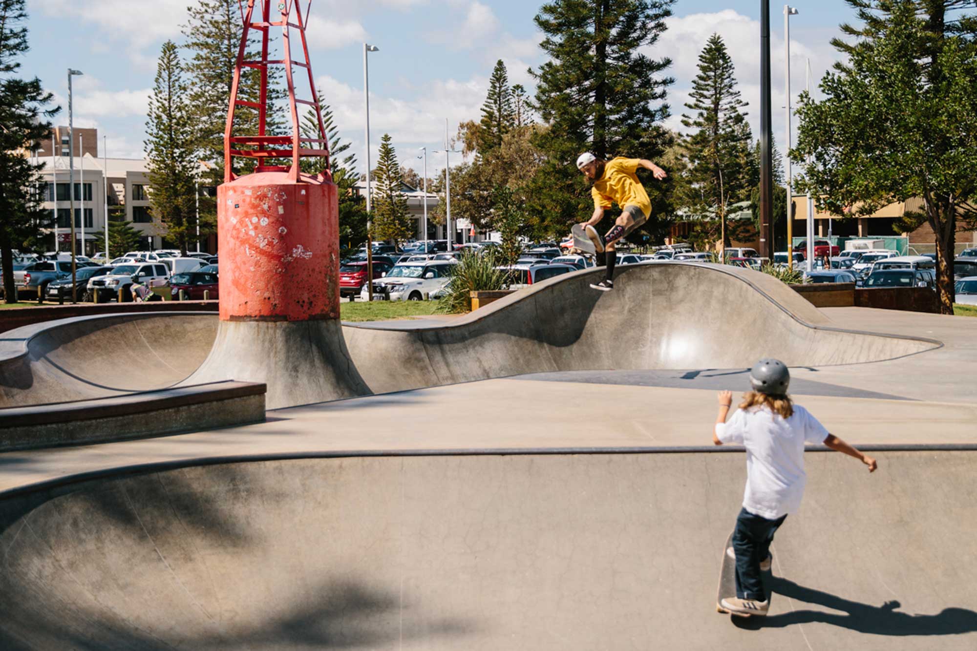 kids skateboarding in a park 