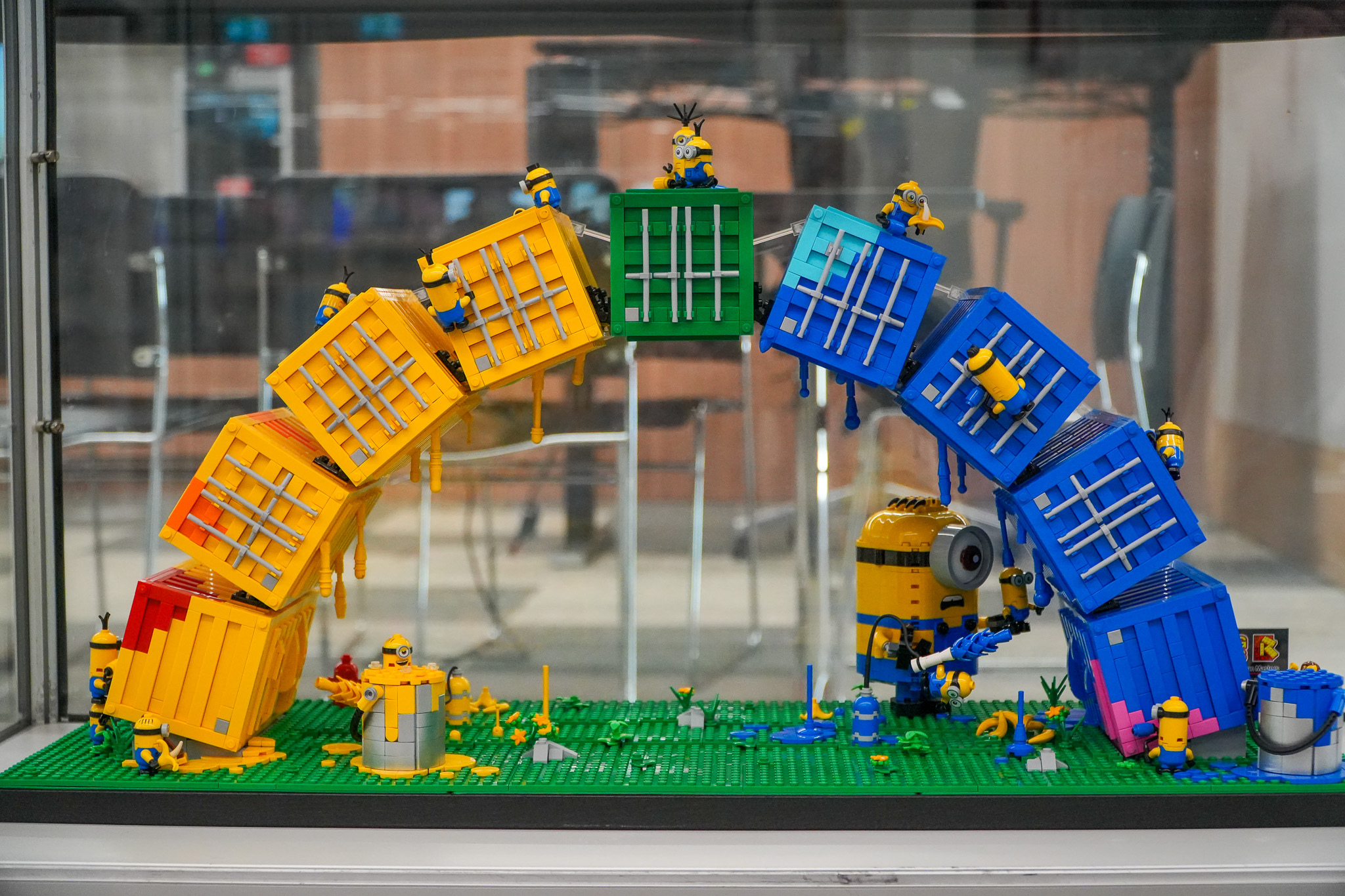 a lego containbow being built by a minion