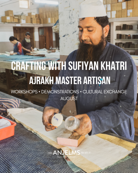 a man crafting at a table in a workshop