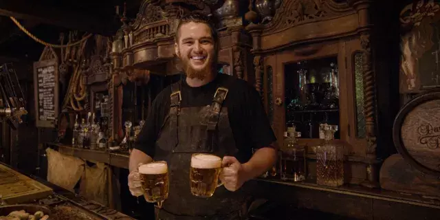 Person holds two beers in shipwreck-themed bar, Darling Darling in Fremantle