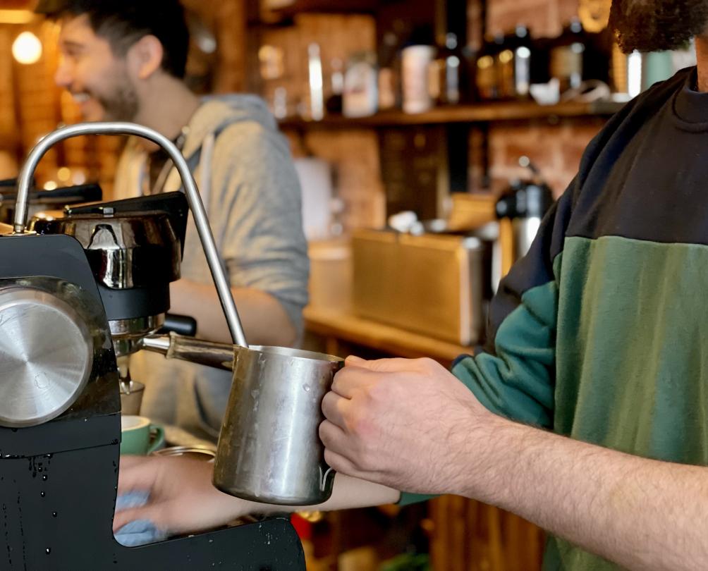 Frothing milk at Hush, my favourite cafe