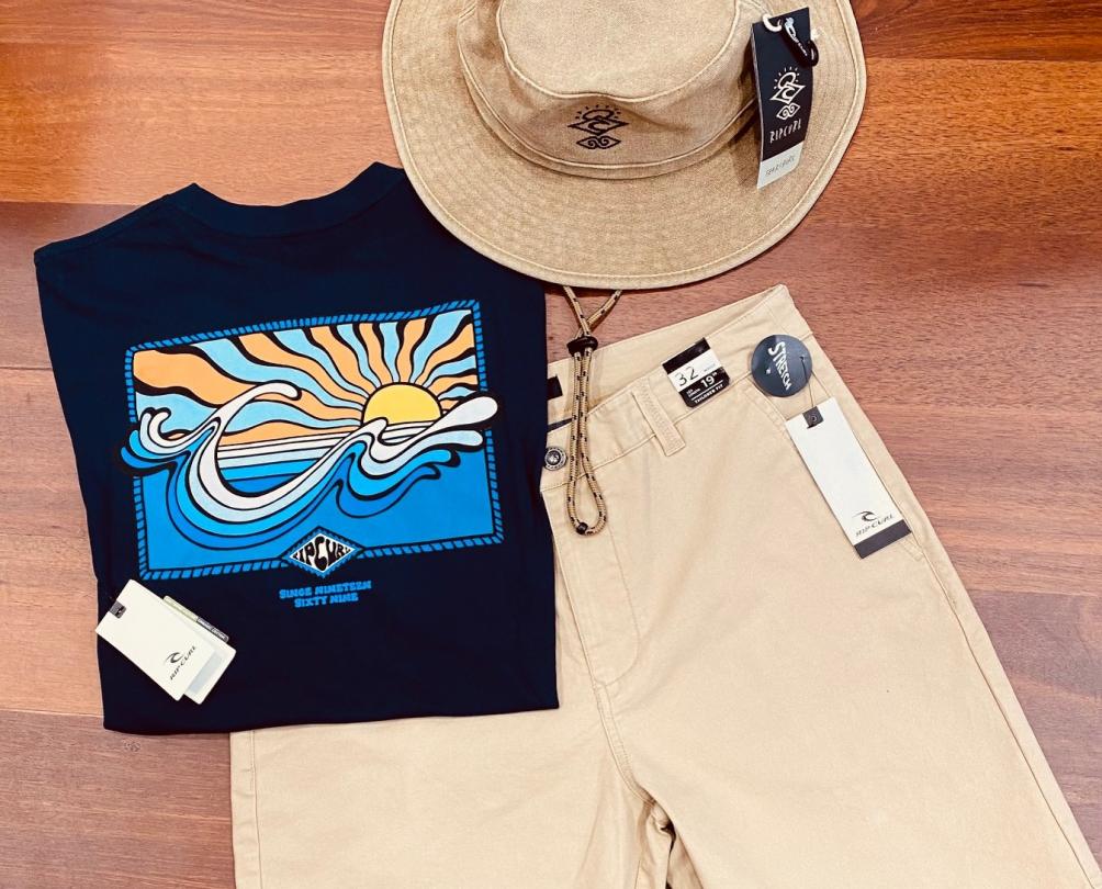flat lay of men's outfit: featuring hat, t-shirt and shorts