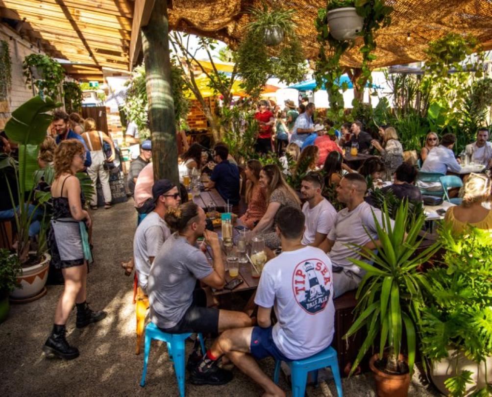 Beer garden at La Cabana in South Fremantle with crows of people casually dining 