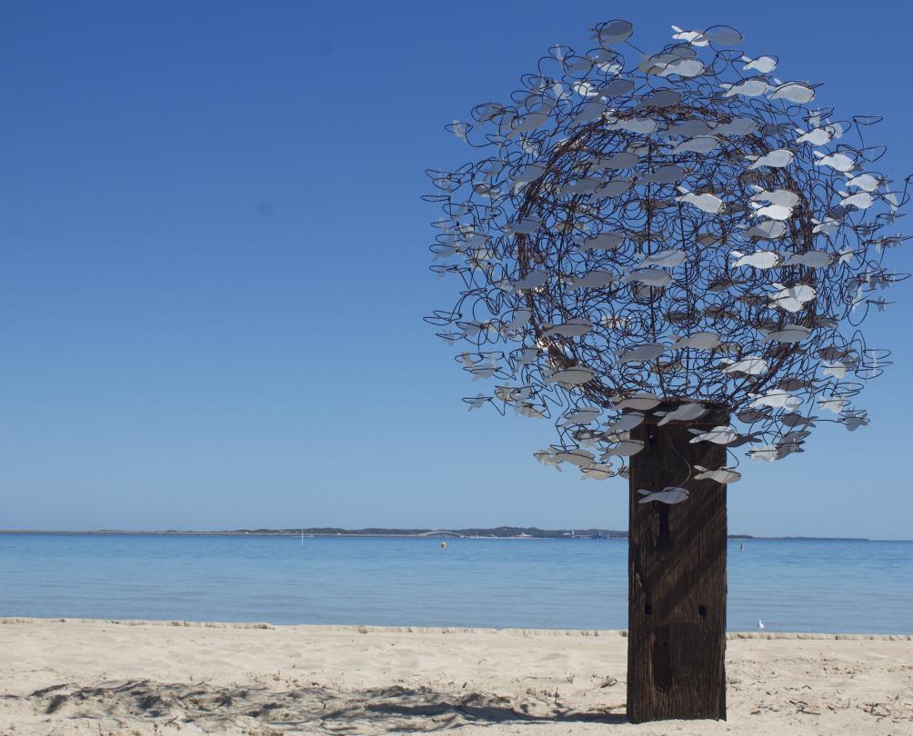 Richard Aitken, Shimmer, 2022, galvanised bed mattress, timber pole, aluminium fish, 220 x 150 x 150 cm Sculpture by Richard Aitken on the sand at Bathers Beach