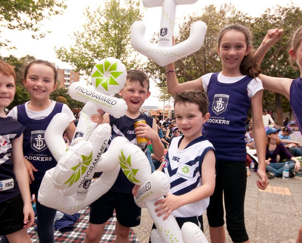 children celebrating Fremantle Dockers in Fremantle