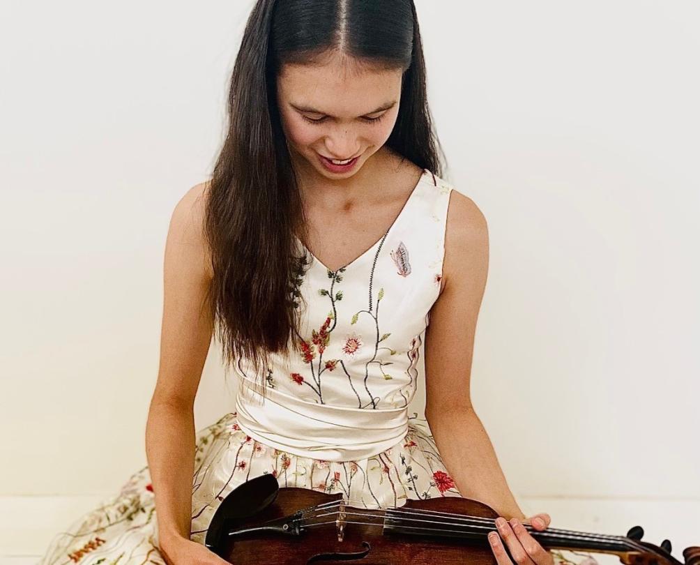 Ellie Malonzo holding a violin 