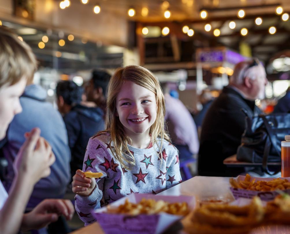 Family fish and chips session at Fremantle Fishing Boat Harbour