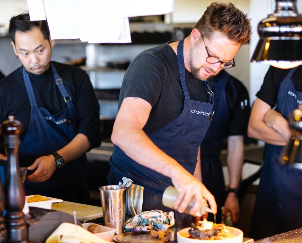 Scott preparing Bib & Tucker's famous grilled octopus.