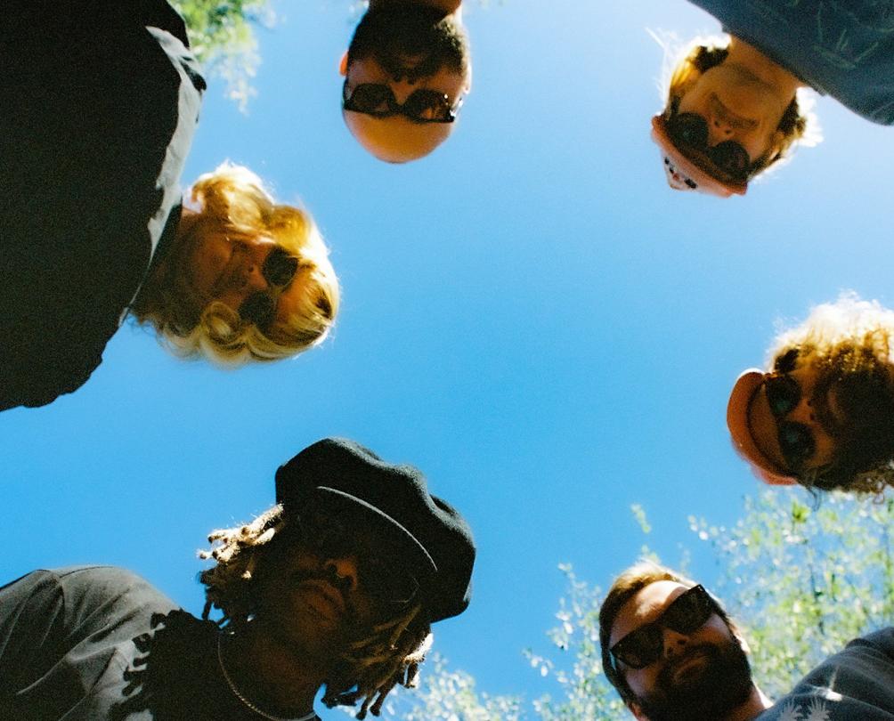 Ocean Alley band members looking down into a camera lens.