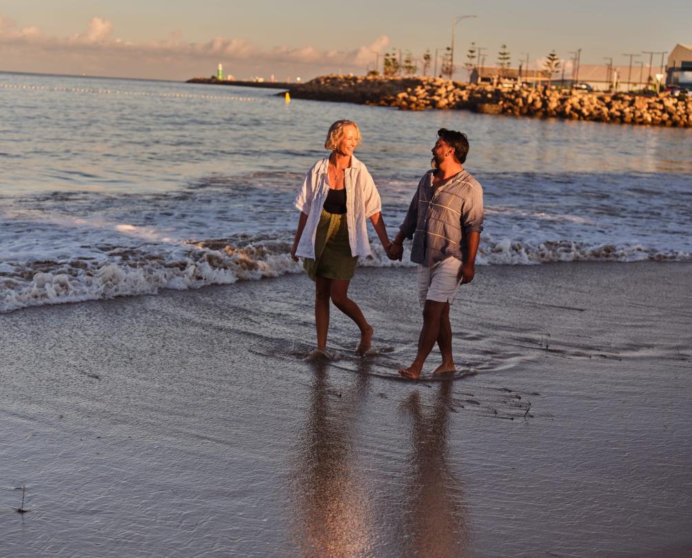 couple walking down the beach