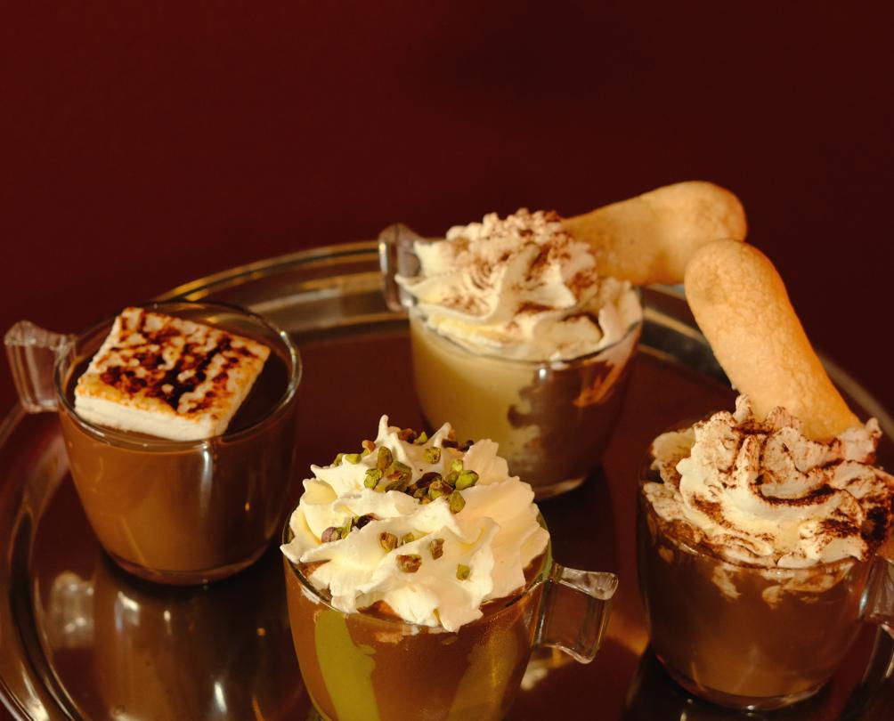 four hot chocolates on a tray
