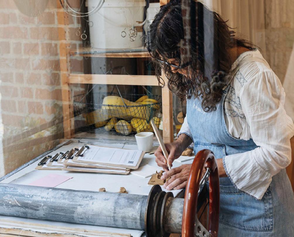 lady looking at a craft table 