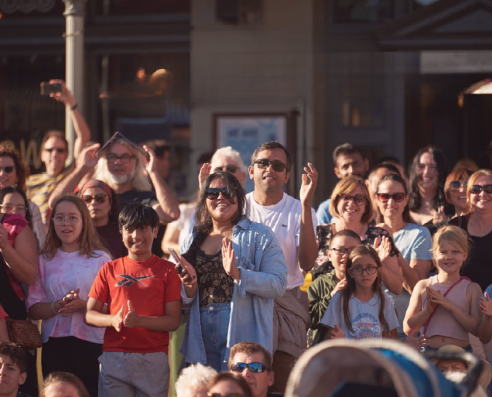 people watching a field cheering