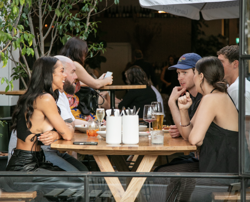 a group of people sitting at H&C Urban Winery