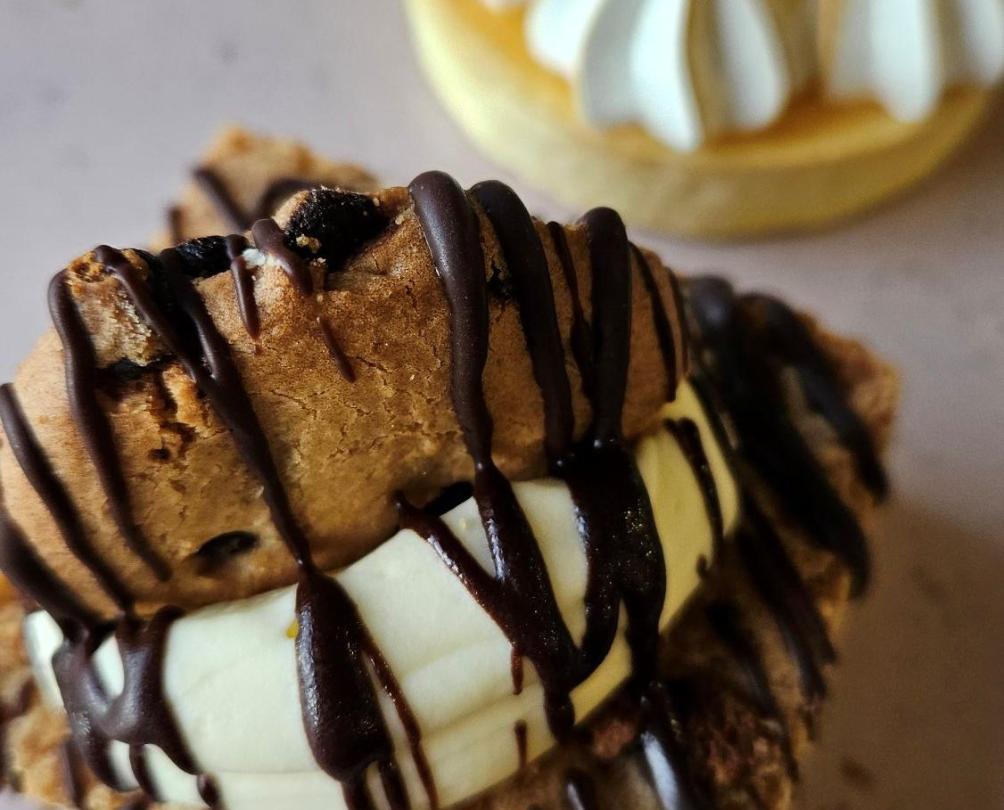 delicious cookies with chocolate drizzle and merengue