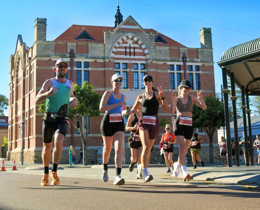 a group of runners in downtown Fremantle 