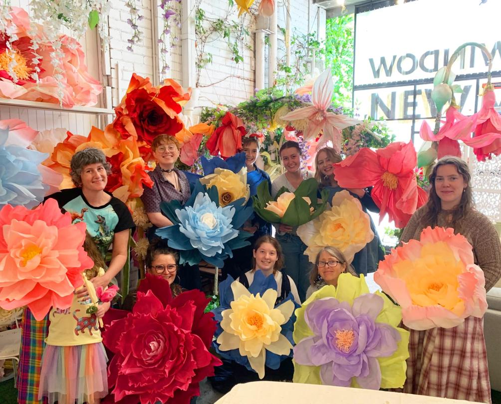 a group of students holding their Jotterbook paper flowers Fremantle