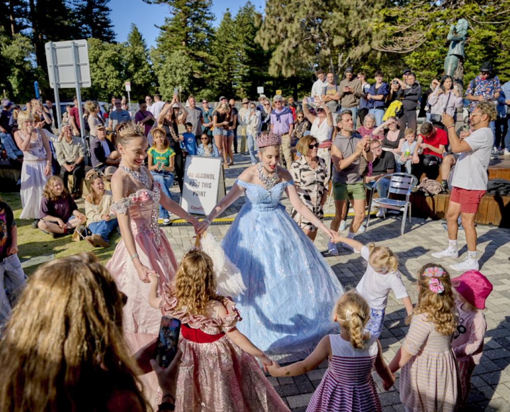 women dancing with children at the Fremantle Fishing Boat Harbour