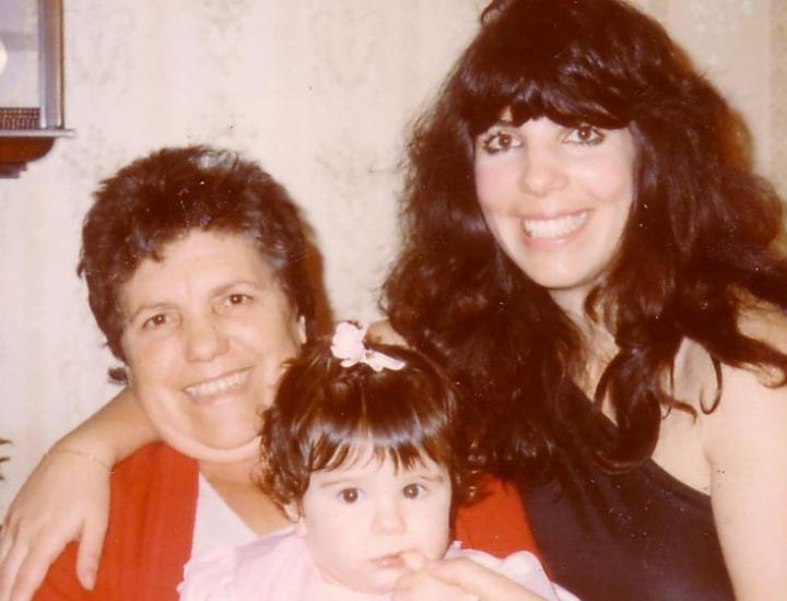 old photos of three generations of women cuddling and smiling