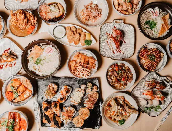 Sushi displayed on assorted plates 