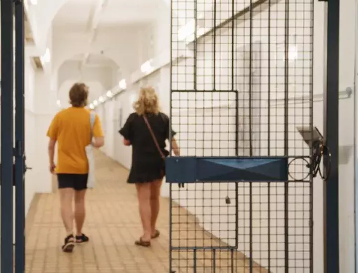 Woodsons Arcade exhibition space, two people walking down the corridor