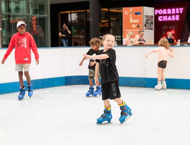 Children skating on rink.