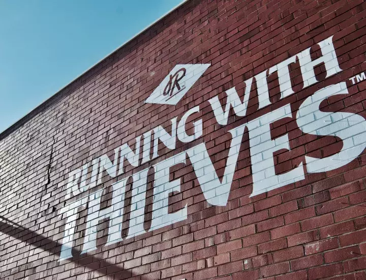 Running with Thieves facade billboard.