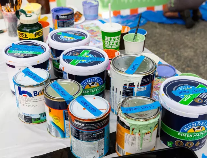 A table full of paint pots.