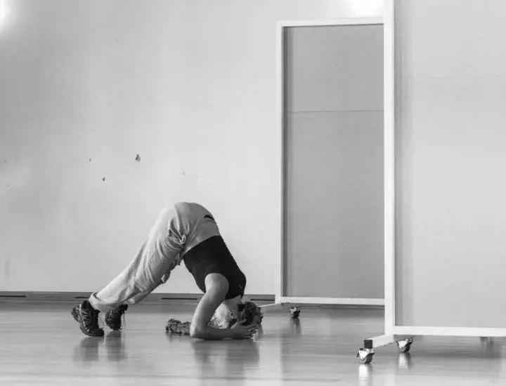 woman doing a dance on the floor 