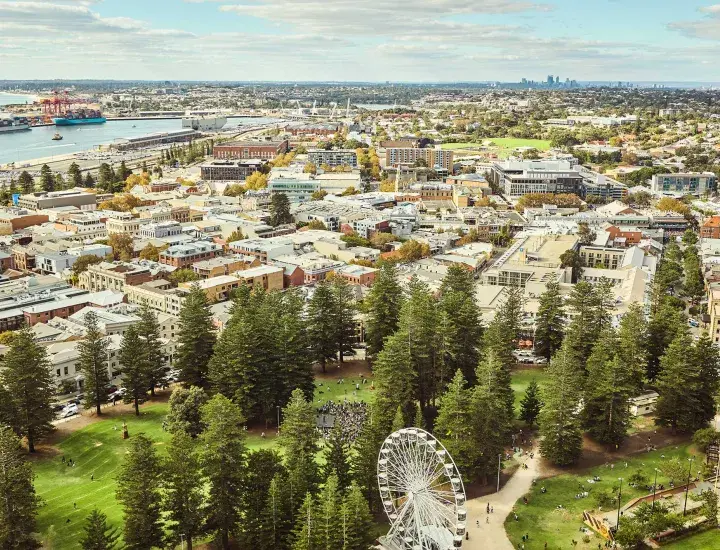 a ferris wheel and an aerial view of Fremantle 
